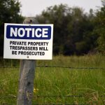 How do I resolve a warrant for trespass after forbidden in Okmulgee lawyer?